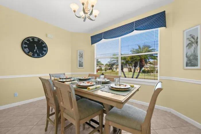 Dining Room: Bright space with charming decor and tropical views for lively meals and gatherings!