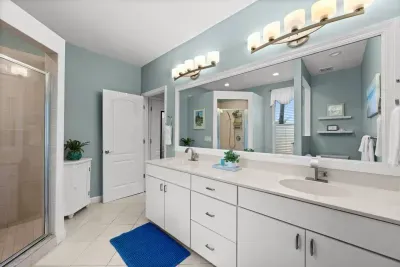 Master Bathroom: Bright and airy space with elegant fixtures and a refreshing walk-in shower!