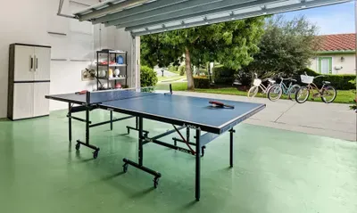 Recreation Room: Challenge friends to a thrilling game of ping pong amidst sunny vibes!