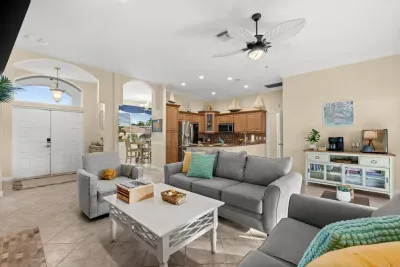 Living Room: Bright and airy space with stylish décor to unwind and enjoy endless vacation vibes!