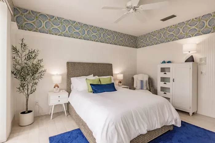 Bedroom Retreat: Bright and airy room with stylish decor and plush bedding for rejuvenating nights!