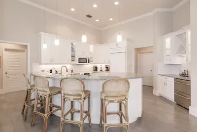 Gourmet Kitchen: Whip up your favorite dishes in this bright, modern space with stylish seating!