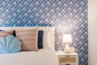 Serene Bedroom Retreat: Dive into comfort with ocean-inspired decor and a restful ambiance!
