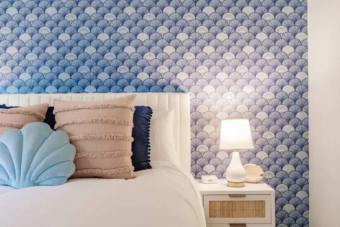 Serene Bedroom Retreat: Dive into comfort with ocean-inspired decor and a restful ambiance!