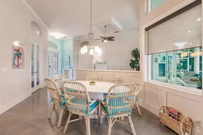 Dining Area: Bright and airy space with chic rattan chairs—perfect for family feasts!