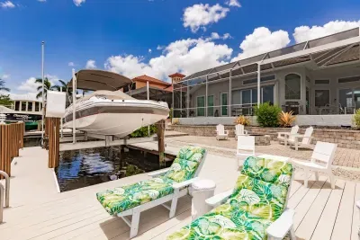 Outdoor Oasis: Relax in stylish loungers with water views and dock access right at your doorstep!