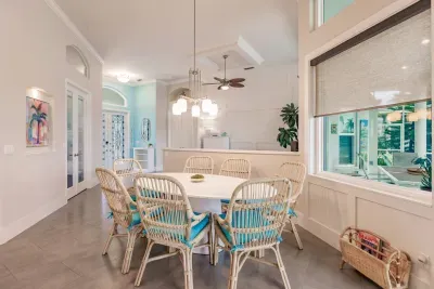 Dining Area: Bright and airy space with chic rattan chairs—perfect for family feasts!