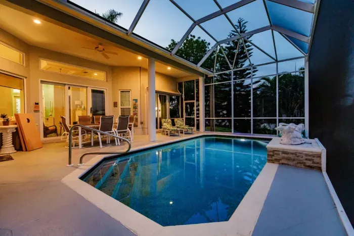 Pool Oasis: Enjoy twilight swims and tropical views from your private heated pool area!