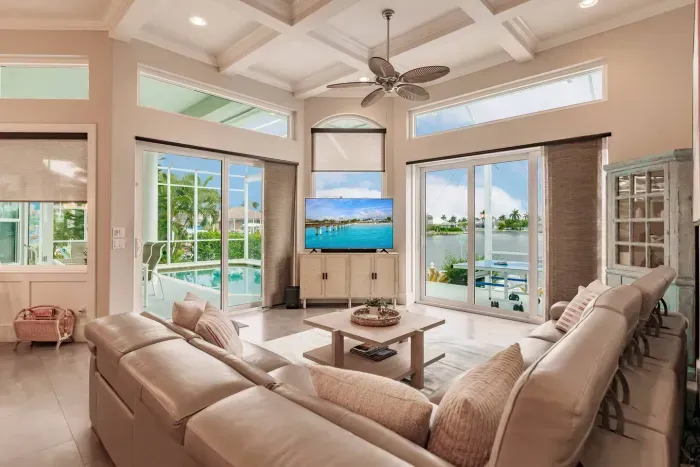 Living Room Oasis: Sun-soaked space with stunning water views and plush seating for ultimate relaxation!