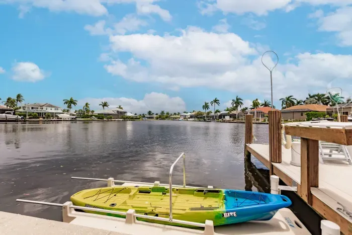 Waterfront Paradise: Enjoy serene views from your private dock with kayaks at your doorstep!