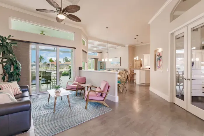 Living Room: Bright and airy space with tropical views, stylish decor, and inviting seating!