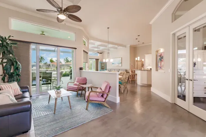 Living Room: Bright and airy space with tropical views, stylish decor, and inviting seating!
