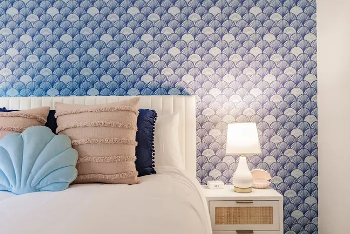 Serene Bedroom Retreat: Dive into comfort with ocean-inspired decor and a restful ambiance!