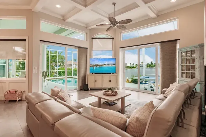 Living Room Oasis: Sun-soaked space with stunning water views and plush seating for ultimate relaxation!