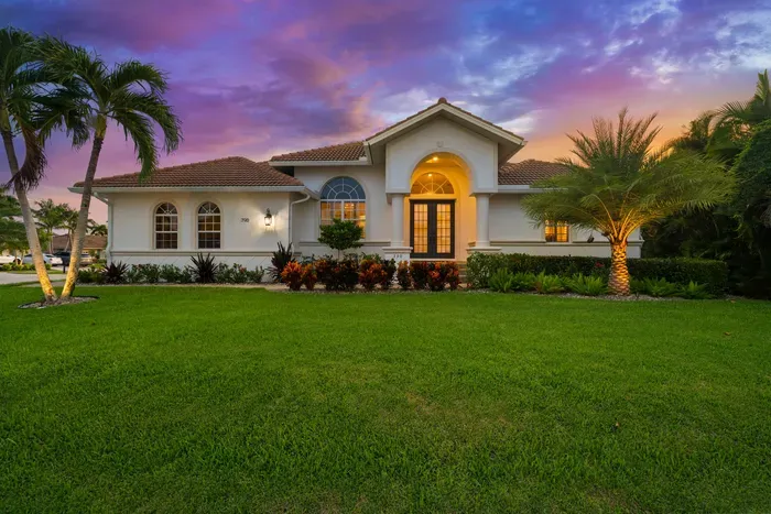 Exterior: Enjoy palm-lined pathways and stunning sunsets from this charming Marco Island retreat!