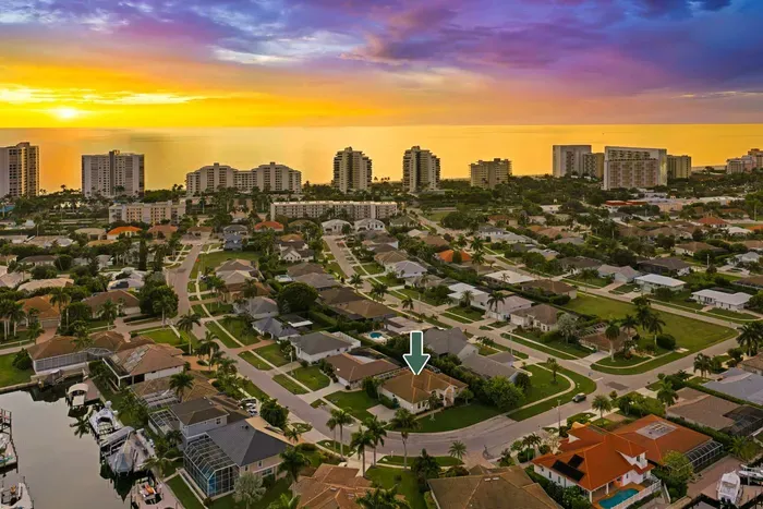 View from Above: Marvel at stunning ocean views and vibrant palm-lined streets below!