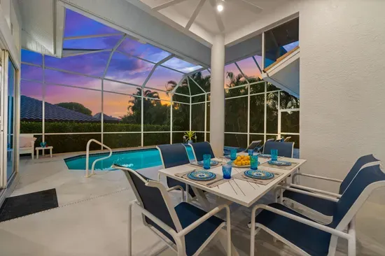 Screened Porch: Dine al fresco with stunning sunset views and a sparkling pool at your fingertips!