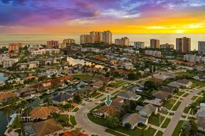 Scenic Overview: Marvel at breathtaking sunset views over Marco Island’s vibrant neighborhoods!