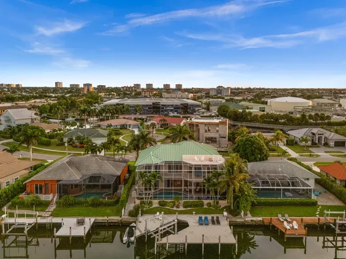 Waterfront home with private dock, pool, and tropical canal views