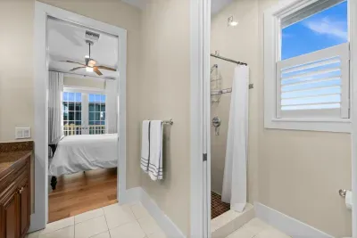 Bright ensuite bath with walk-in shower and bedroom access