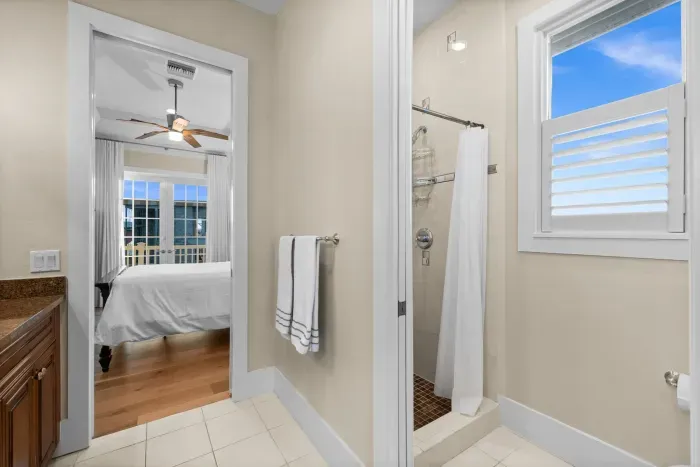 Bright ensuite bath with walk-in shower and bedroom access