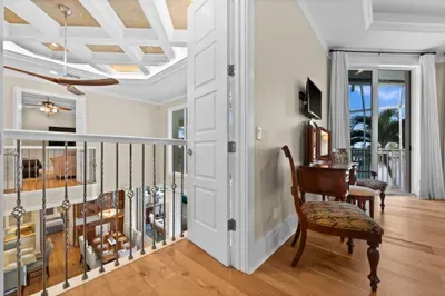 Elegant upstairs landing with balcony access and tropical views