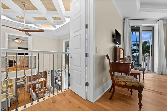 Elegant upstairs landing with balcony access and tropical views