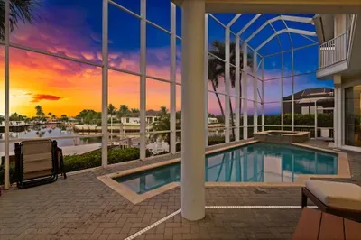 Private screened pool & spa with stunning waterfront sunset views