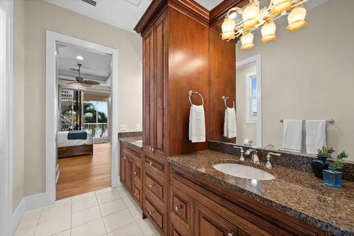 Elegant bathroom vanity with granite counters and abundant storage
