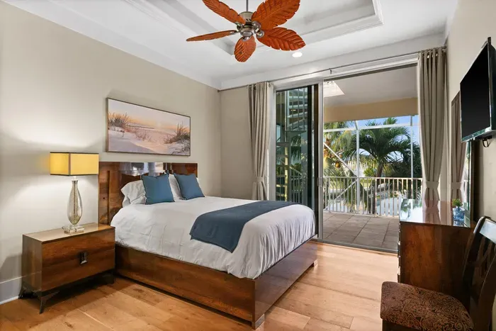 Cozy tropical bedroom with private balcony and palm-view retreat