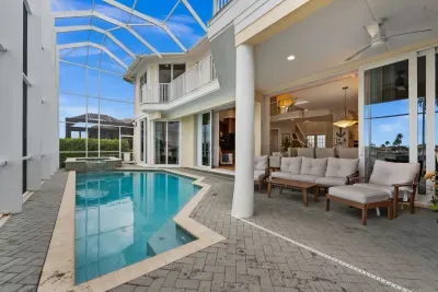 Private screened pool & spa with stylish covered outdoor lounge