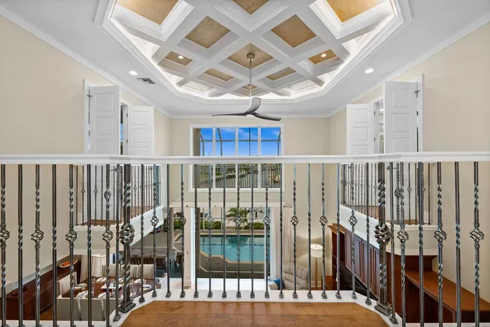 Elegant mezzanine with dramatic ceiling overlooking indoor pool atrium