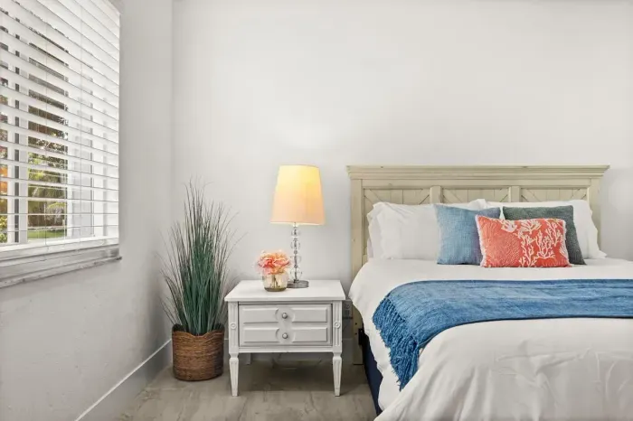 Bright, airy bedroom with coastal accents and natural light