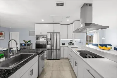 Bright modern kitchen with island, stainless appliances, and ample counter space