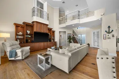 Bright grand living room with high ceilings and elegant built-ins