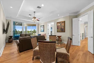 Bright living space with balcony access and scenic water views