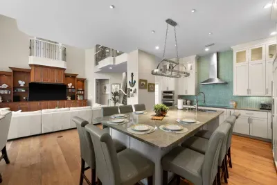 Spacious open-concept kitchen and living area with island seating for 6