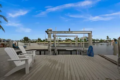 Private waterfront dock with boat lift and relaxing canal views