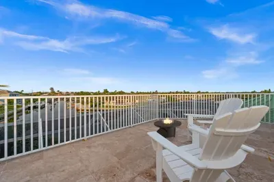 Private rooftop terrace with fire pit and scenic water views