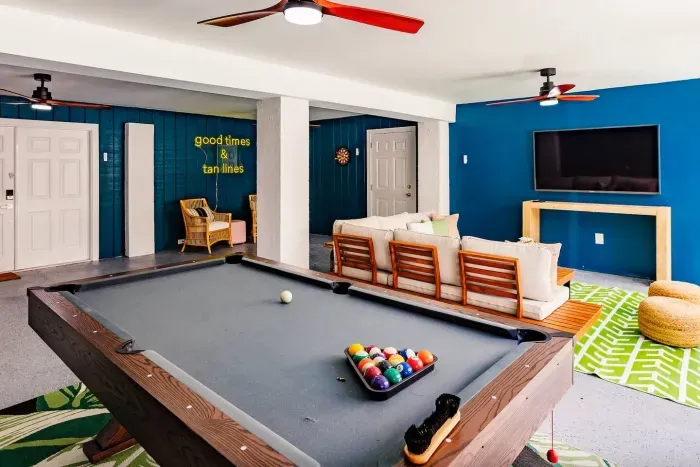 Game Room: Enjoy fun-filled evenings with billiards, cozy seating, and vibrant decor!