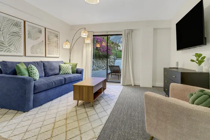 Chic elegance awaits you with vibrant decor and a view of blooming nature!