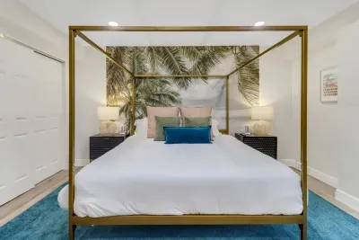 Bedroom Retreat: Elegant four-poster bed with tropical accents and soothing ambiance awaits you!