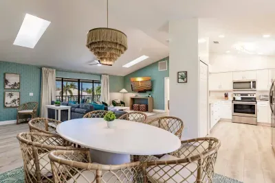 Dining: Bright and airy space with a stunning view, stylish decor, and vibrant coastal vibes!