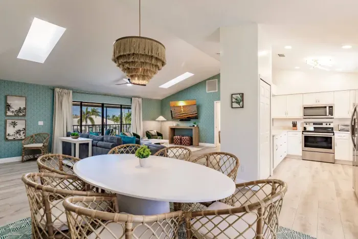 Dining: Bright and airy space with a stunning view, stylish decor, and vibrant coastal vibes!