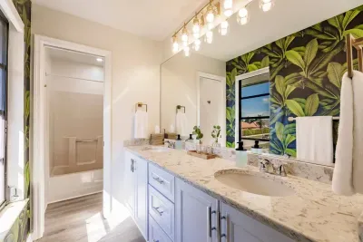 Bathroom Bliss: Bright and airy with elegant finishes and tropical vibes!