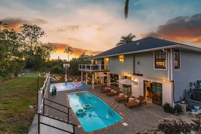 Outdoor Paradise: Dive into fun with a sparkling pool, lounge chairs, and sunset views!