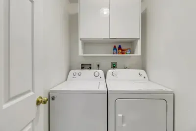 Laundry Room: Convenient in-unit washer and dryer for effortless beach day prep!