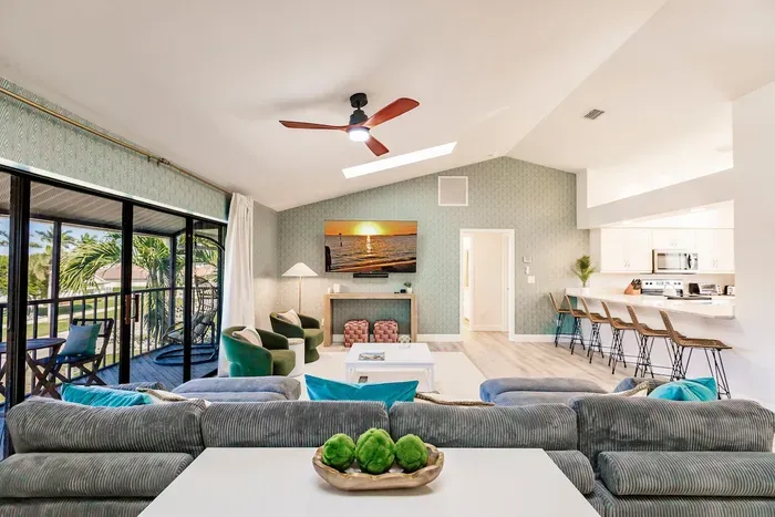Living Room Retreat: Bright, airy space with stylish seating and stunning sunset views!
