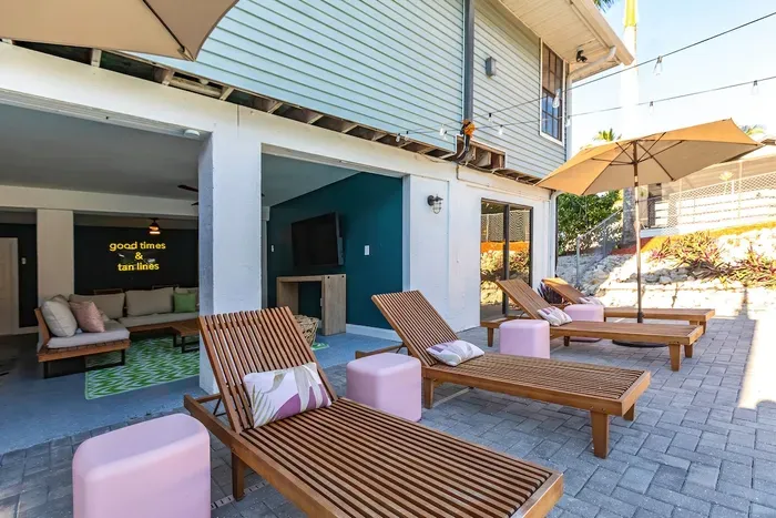 Outdoor Lounge Area: Sip cocktails under sunny skies, unwind on stylish loungers, and enjoy island vibes!