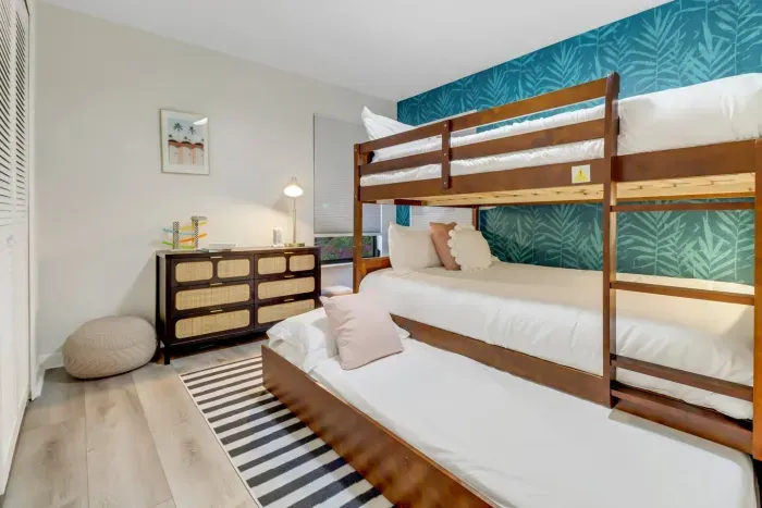 Bunk Room: Vibrant walls and playful bunks create the perfect retreat for kids and adults alike!